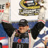 Tony Stewart celebrates with his crew in Victory Lane after winning the NASCAR Sprint Cup Series auto race at New Hampshire Motor Speedway, Sunday, Sept. 25, 2011, in Loudon, N.H. (AP Photo/Jim Cole)