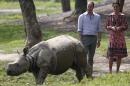 Britain's Prince William (L), Duke of Cambridge, and Catherine, Duchess of Cambridge, look at young rhino at the Centre for Wildlife Rehabilitation and Conservation in Kaziranga in the northeastern state of Assam on April 13, 2016