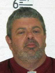 This booking photograph released by the Maine State Police shows Timothy Courtois, who was arrested Sunday, July 22, 2012 on charges of having a concealed weapon and speeding on the Maine Turnpike. Courtois told authorities he was on his way to Derry, N.H., to shoot a former employer. He also said he had attended the Batman movie at the Cinemagic Theater in Saco the previous night. Found in his car were an assault weapon, four handguns and several boxes of ammunition.  A search of his home in Biddeford, Maine, revealed several additional guns, including a machine gun, and thousands of rounds of ammunition. (AP Photo/Maine State Police)