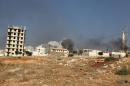 Smoke rises after an airstrike on the rebel held al-Rashideen neighbourhood, Western Aleppo province