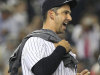 New York Yankees' Jorge Posada reacts while celebrating with teammates after the Yankees clinched the AL East title with a 4-2 win over the Tampa Bay Rays in the second game of a baseball doubleheader Wednesday, Sept. 21, 2011, in New York. (AP Photo/Frank Franklin II)