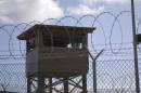 File photo of a soldier standing guard in a tower overlooking Camp Delta at Guantanamo Bay naval base