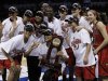 Louisville's team poses for a photo after defeating Tennessee during the Oklahoma City regional final game in the women's NCAA college basketball tournament in Oklahoma City, Tuesday, April 2, 2013.   Louisville own 86-78.  (AP Photo/Alonzo Adams)