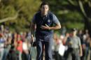 Europe's Rory McIlroy bows after making his putt to win his match 3 & 2 during a four-balls match at the Ryder Cup golf tournament Friday, Sept. 30, 2016, at Hazeltine National Golf Club in Chaska, Minn. (AP Photo/Charlie Riedel)
