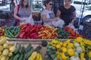 Shoppers buy vegatables at a local Farmers Market in Annandale, Virginia, August 8, 2013