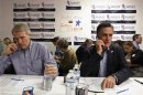 U.S. Republican presidential candidate and former Massachusetts Governor Mitt Romney and Senator Rob Portman (R-OH) call potential voters from his campaign headquarters in Charleston, South Carolina