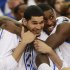 Kentucky's Eloy Vargas, left, and Michael Kidd-Gilchrist reacts in the closing seconds of the NCAA tournament South Regional final college basketball game against Baylor on Sunday, March 25, 2012, in Atlanta. Kentucky won 82-70. (AP Photo/John Bazemore)