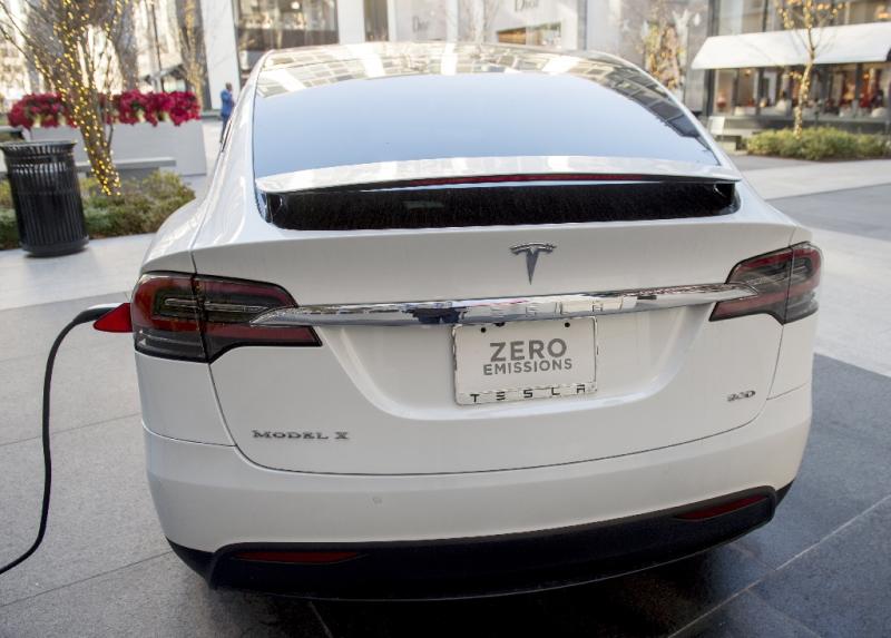 Tesla, whose Model X electric SUV is seen charging, produced 24,882 vehicles in the final quarter of the year, resulting in total 2016 production of 83,922 vehicles