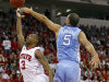 North Carolina State's Alex Johnson (3) drives to the basket as North Carolina's Kendall Marshall (5) defends during the first half of an NCAA college basketball game in Raleigh, N.C., Tuesday, Feb. 21, 2012. (AP Photo/Gerry Broome)