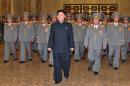This picture taken by KCNA on October 10, 2013 shows North Korean leader Kim Jong-Un (C), accompanied by senior army officials, visiting the Kumsusan Palace in Pyongyang