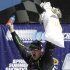 Kyle Busch celebrates his victory in the NASCAR Sprint Cup Series auto race at Michigan International Speedway in Brooklyn, Mich., Sunday, Aug. 21, 2011. (AP Photo/Paul Sancya)