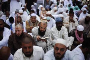 File photo of a Muslim pilgrim reading the Koran at …