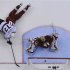 Los Angeles Kings' Carter scores on Phoenix Coyotes' Smith while falling on top of Coyotes' Vermette during Game 2 of the NHL Western Conference hockey finals in Glendale.