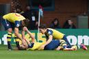 Arsenal's Aaron Ramsey, center, celebrates scoring his side's first goal of the game against Burnley alongside teammates Hector Bellerin, right, and Olivier Giroud during their English Premier League soccer match at Turf Moor, Burnley, England, Saturday, April 11, 2015. (AP Photo/Dave Howarth, PA Wire) UNITED KINGDOM OUT - NO SALES - NO ARCHIVES