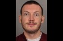 FILE - This file photo provided on Sept. 20, 2012 by the Arapahoe County Sheriff's Office shows James Holmes. Holmes, the suspect in a deadly movie theater attack in Colorado, threatened a professor before the shooting, leading the university to ban him from campus, prosecutors said in court documents released Friday, Sept. 28, 2012. (AP Photo/Arapahoe County Sheriff, File)