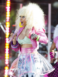 Nicki Minaj reacts following a wardrobe malfunction during a live performance on ABC's Good Morning America in New York, Friday, Aug. 5, 2011. (AP Photo/Charles Sykes)
