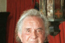 FILE - In a 1999 file photo, the late country music legend Johnny Cash poses at his Hendersonville, Tenn. home. Kenny Chesney, Kris Kristofferson, Lucinda Williams, Ray LaMontagne and Jamey Johnson are among the performers scheduled to appear in â€œWe Walk the Line: A Celebration of the Music of Johnny Cashâ€ on April 20 at the Austin City Limits Live venue in Austin, Texas. (AP Photo/Mark Humphrey, file)