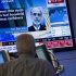 A trader looks up at monitor after Federal Reserve Chairman Ben Bernanke's speech concludes on the floor of the New York Stock Exchange on Friday, Aug. 26, 2011, in New York. (AP Photo/Jin Lee)