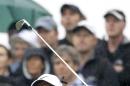 Tiger Woods of the US plays his tee shot from the 14th during the third day of the British Open Golf championship at the Royal Liverpool golf club, Hoylake, England, Saturday July 19, 2014. (AP Photo/Peter Morrison)