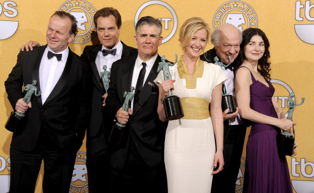 From left, Robert Clohessy, Michael Shannon, Kevin O'Rourke, Gretchen Mol, Peter Van Wagner and Aleksa Palladino pose backstage with their awards for outstanding performance by an ensemble in a drama series for "Boardwalk Empire" at the 18th Annual Screen Actors Guild Awards on Sunday Jan. 29, 2012 in Los Angeles. (AP Photo/Chris Pizzello)