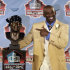 Deion Sanders poses with a bust of himself during the induction ceremony at the Pro Football Hall of Fame, Saturday, Aug. 6, 2011, in Canton, Ohio. (AP Photo/Tony Dejak)