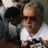 Force India team principal Vijay Mallya talks to the media in the paddock during the third practice session of the Indian F1 Grand Prix at the Buddh International Circuit in Greater Noida