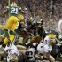 In this photo taken Thursday, Sept. 8, 2011, the Green Bay Packers defense stops New Orleans Saints running back Mark Ingram (28) short of the goal line on the last play of the fourth quarter of an NFL football game in Green Bay, Wis. The Packers won 42-34. (AP Photo/Mike Roemer)