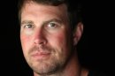 FILE - In this July 27, 2010, file photo, former NFL quarterback Ryan Leaf is shown in Holter Lake, Mont. Authorities say Leaf was arrested in his Montana hometown on burglary and drug possession charges on Friday, March 30, 2012. (AP Photo/Mike Albans, File)