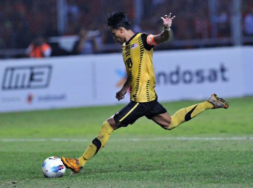 Malaysia captain Bakhtiar Baddrol kicks a penalty shot marking the victory for his team in the final