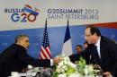 US President Barack Obama (L) shakes hands with French President Francois Hollande during a bilateral meeting in Saint Petersburg on September 6, 2013 on the sideline of the G20 summit