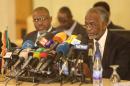 Sudanese Foreign Minister Ali Karti (R) attends a press conference on the sidelines of meetings in Khartoum on March 3, 2015 between Sudan, Egypt and Ethiopia to try to resolve a dispute over a dam being built by Addis Ababa on the Nile