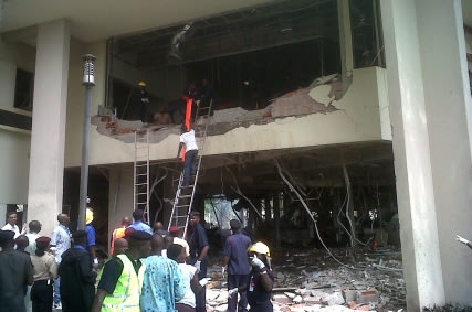 This image released by Saharareporters shows firefighters and rescue workers after a large explosion struck the United Nations' main office in Nigeria's capital Abuja Friday Aug. 26, 2011, flattening 