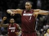 Miami Heat's Chris Bosh (1) yells after scoring the winning basket during the second half of an NBA basketball game against the San Antonio Spurs, Sunday, March 31, 2013, in San Antonio. Miami won 88-86. (AP Photo/Darren Abate)