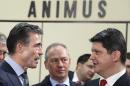 Rasmussen talks to Corlatean during a NATO foreign ministers meeting in Brussels