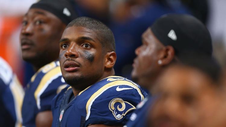 Michael Sam of the St. Louis Rams watches from the bench during the second half of a pre-season against the New Orleans Saints game at the Edward Jones Dome on August 8, 2013 in St. Louis, Missouri