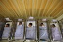 File photo shows babies lying in cots at a maternity ward in Singapore