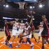 Heat's Bosh leaps to block Knicks' Brewer as he looks to shoot in the first quarter of their NBA basketball game in New York