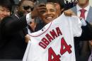 U.S. President Barack Obama poses with player David Ortiz for a "selfie" as he welcomes the 2013 World Series Champion Boston Red Sox to the South Lawn of the White House in Washington