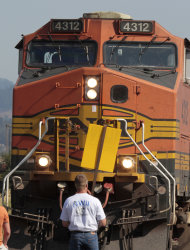 A union worker blocks a grain train in Longview, Wash., Wednesday, Sept. 7, 2011. Longshoremen blocked the train as part of an escalating dispute about labor at the EGT grain terminal at the Port of Longview.(AP Photo/Don Ryan)