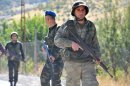 Turkish soldiers patrol on a road in the southeastern province of Sirnak