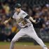 Oakland Athletics starting pitcher Brandon McCarthy delivers against the Seattle Mariners in the first inning of a baseball game, Monday, Sept. 26, 2011, in Seattle. (AP Photo/Elaine Thompson)