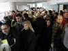 People queue at a tax office during the last working day of the year in northern Athens, Wednesday, Dec. 28, 2011. Tax office employees will hold a 48-hour strike on Thursday and Friday against planned pay cuts and the implementation of a new emergency property tax. (AP Photo/Thanassis Stavrakis)