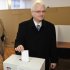 Croatia's president Ivo Josipovic casts his ballot at a polling station in Zagreb, Croatia, Sunday, Jan. 22, 2012. Croatians vote Sunday in a nationwide referendum on whether to join the European Union, a test of how much the debt-stricken 27-nation bloc has lost its appeal among potential new members. (AP Photo/Darko Bandic)