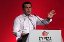 Greek Prime Minister Tsipras gestures as he delivers his speech during a central committee of leftist Syriza party in Athens