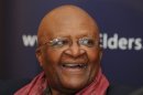 Desmond Tutu said he had been "wrestling with his conscience" over Tony Blair