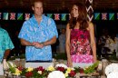 Britain's Prince William, left, and his wife Kate prepare to sit for a meal at Government House in Honiara, Solomon Islands, Sunday, Sept. 16, 2012. The royal couple is on a nine-day tour of the Far East and South Pacific in celebration of Queen Elizabeth II's Diamond Jubilee. (AP Photo/William West, Pool)