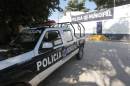 A police patrol pickup is parked by the empty barracks of the municipal police in Iguala, Mexico, on October 6, 2014