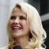 FILE - This May 25, 2011 file photo shows Elizabeth Smart talking to the media in front of the Frank E. Moss Federal Courthouse in Salt Lake City.  A family spokesman says the Utah woman who was kidnapped at knifepoint at age 14 and held captive for nine months married Matthew Gilmour on Saturday Feb. 18, 2012 in Oahu. The 24-year-old Smart is a senior at Brigham Young University. She met Gilmour, of Aberdeen, Scotland, while serving a Church of Jesus Christ of Latter-day Saints mission in France.   (AP Photo/Jim Urquhart, File)