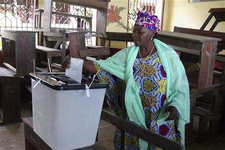 A woman casts her ballot at a polling station in Guinea's capital Conakry September 28, 2013. REUTERS/Saliou Samb