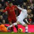 Liverpool's Suarez challenges Southampton's Yoshida during their English Premier League soccer match at Anfield in Liverpool